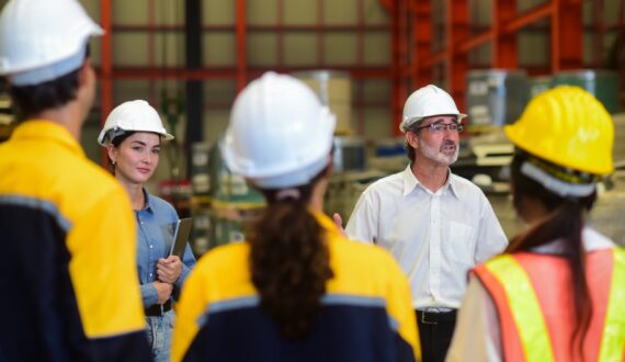 Professional,Caucasian,Manager,Engineer,Wearing,Safety,Hardhat,Is,Training,Industry